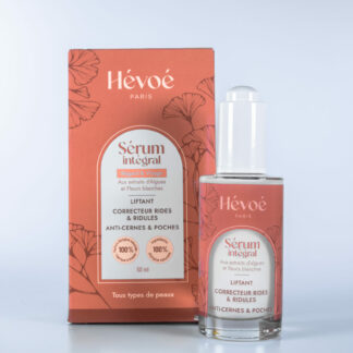 Sérum anti-âge Hévoé flacon pompe et packaging, soin liftant naturel pour visage et regard, anti-cernes, anti-rides, vegan, 50ml.